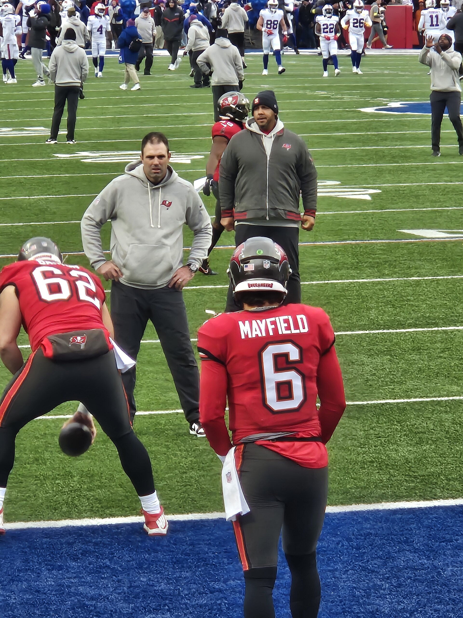 Tampa Bay Buccaneers quarterback Baker Mayfield and center Graham Barton warming up before playing Buffalo Bills