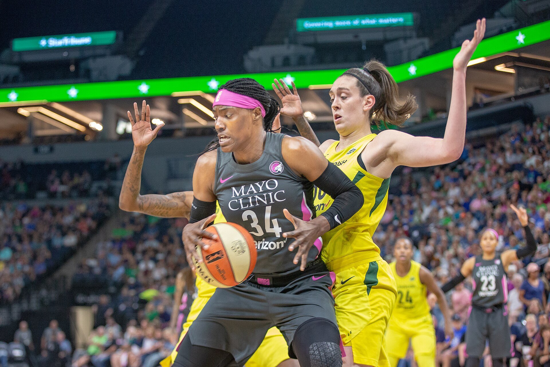 Sylvia Fowles (34) handles the ball under the basket as she's guarded by Breanna Stewart (30) in the Minnesota Lynx vs Seattle Storm game at Target Center, the Storm won the game 81-72