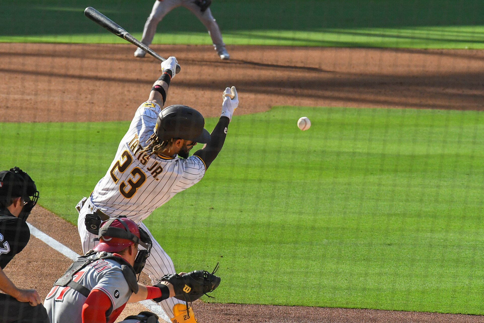 Fernando Tatis Jr. of the San Diego Padres hits a grounder in a game against the Cincinnati Reds on June 19th, 2021